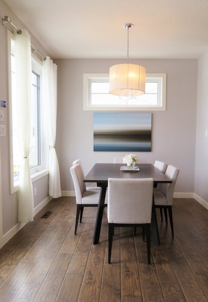 service-02 A bright, contemporary dining room with minimalist decor and modern furnishings.