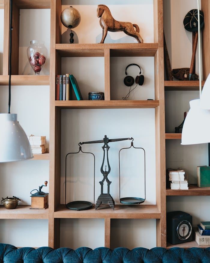 service-06 Elegant home interior featuring a wooden bookshelf with various decorative items and books.